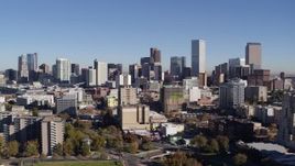 5.7K aerial stock footage of the city's skyline, flyby office and apartment buildings in foreground, Downtown Denver, Colorado Aerial Stock Footage | DX0001_001670