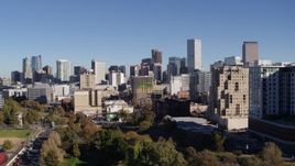 5.7K aerial stock footage reverse view of the city's skyline while descending near office buildings, Downtown Denver, Colorado Aerial Stock Footage | DX0001_001673