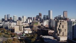 5.7K aerial stock footage ascend from park to approach the city's skyline, Downtown Denver, Colorado Aerial Stock Footage | DX0001_001674