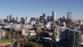 5.7K aerial stock footage of the city's skyline behind apartment and office buildings, Downtown Denver, Colorado Aerial Stock Footage | DX0001_001676