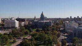 5.7K aerial stock footage of the Colorado State Capitol building, seen while ascending from park, Downtown Denver, Colorado Aerial Stock Footage | DX0001_001689