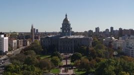 5.7K aerial stock footage ascend from park while focusing on Colorado State Capitol, Downtown Denver, Colorado Aerial Stock Footage | DX0001_001700