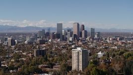 5.7K aerial stock footage of the city's skyline with mountains in the background, Downtown Denver, Colorado Aerial Stock Footage | DX0001_001721