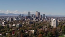 5.7K aerial stock footage of the city's skyline with mountains in the background, seen during descent, Downtown Denver, Colorado Aerial Stock Footage | DX0001_001722