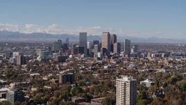5.7K aerial stock footage of wide view of the city's skyline, mountains in distance, Downtown Denver, Colorado Aerial Stock Footage | DX0001_001728
