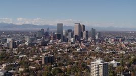 5.7K aerial stock footage of slow approach to the city's skyline, mountains in distance, Downtown Denver, Colorado Aerial Stock Footage | DX0001_001729