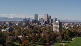 5.7K aerial stock footage of the city's skyline, mountains in distance, seen while descending, Downtown Denver, Colorado Aerial Stock Footage | DX0001_001730