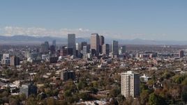 5.7K aerial stock footage wider view of the city's skyline, with the mountains in background, Downtown Denver, Colorado Aerial Stock Footage | DX0001_001733