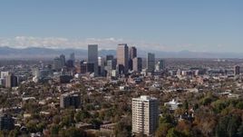 5.7K aerial stock footage flying by the city's skyline, with the mountains in background, Downtown Denver, Colorado Aerial Stock Footage | DX0001_001734