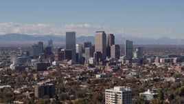 5.7K aerial stock footage slowly passing the city's skyline with mountains in background, Downtown Denver, Colorado Aerial Stock Footage | DX0001_001739