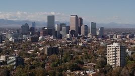 5.7K aerial stock footage of focusing on the city's skyline with mountains in distance during descent, Downtown Denver, Colorado Aerial Stock Footage | DX0001_001746