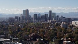 5.7K aerial stock footage of a stationary view of the city's skyline with Rockies in the background, Downtown Denver, Colorado Aerial Stock Footage | DX0001_001752