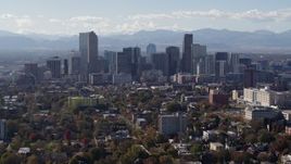 5.7K aerial stock footage of flying by the city's skyline with Rockies in the background, Downtown Denver, Colorado Aerial Stock Footage | DX0001_001753