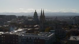 5.7K aerial stock footage of Colorado State Capitol, seen while passing the cathedral in Downtown Denver, Colorado Aerial Stock Footage | DX0001_001781