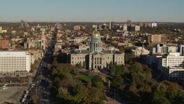 5.7K aerial stock footage flyby the Colorado State Capitol and tree-lined park, hover for stationary view in Downtown Denver, Colorado Aerial Stock Footage | DX0001_001789