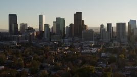 5.7K aerial stock footage slowly descent while flying by the skyline at sunset, Downtown Denver, Colorado Aerial Stock Footage | DX0001_001813