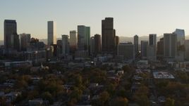 5.7K aerial stock footage slowly ascend while flying by the skyline at sunset, Downtown Denver, Colorado Aerial Stock Footage | DX0001_001814