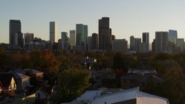 5.7K aerial stock footage of descending with a view of the city skyline at sunset, Downtown Denver, Colorado Aerial Stock Footage | DX0001_001821