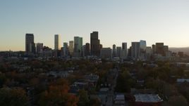 5.7K aerial stock footage ascend and flyby the city skyline at sunset, Downtown Denver, Colorado Aerial Stock Footage | DX0001_001823