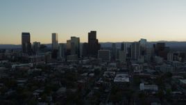 5.7K aerial stock footage of flying away from the city skyline at sunset, Downtown Denver, Colorado Aerial Stock Footage | DX0001_001829
