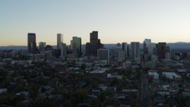 5.7K aerial stock footage of passing by the city skyline at sunset, Downtown Denver, Colorado Aerial Stock Footage | DX0001_001830