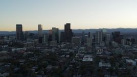 5.7K aerial stock footage of passing by the city skyline while ascending at sunset, Downtown Denver, Colorado Aerial Stock Footage | DX0001_001831