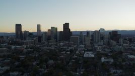 5.7K aerial stock footage of the city skyline at sunset while approaching and ascending, Downtown Denver, Colorado Aerial Stock Footage | DX0001_001835