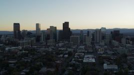 5.7K aerial stock footage reverse view of the city skyline during descent at sunset, Downtown Denver, Colorado Aerial Stock Footage | DX0001_001836