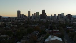 5.7K aerial stock footage of a reverse view of the city skyline at sunset, Downtown Denver, Colorado Aerial Stock Footage | DX0001_001838