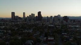 5.7K aerial stock footage fly away from the city skyline at sunset during descent, Downtown Denver, Colorado Aerial Stock Footage | DX0001_001840