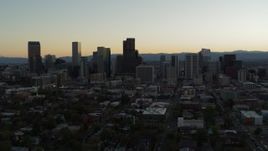 5.7K aerial stock footage flyby the city skyline at sunset during descent, Downtown Denver, Colorado Aerial Stock Footage | DX0001_001842