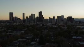 5.7K aerial stock footage of flying by the city's skyline at sunset in Downtown Denver, Colorado Aerial Stock Footage | DX0001_001845