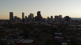 5.7K aerial stock footage ascend while flying by the city's skyline at sunset, Downtown Denver, Colorado Aerial Stock Footage | DX0001_001849
