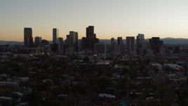 5.7K aerial stock footage slow descent while flying by the city's skyline at sunset, Downtown Denver, Colorado Aerial Stock Footage | DX0001_001850