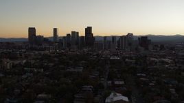 5.7K aerial stock footage slow descent with view of the city's skyline at sunset, Downtown Denver, Colorado Aerial Stock Footage | DX0001_001854