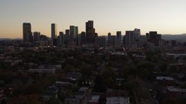 5.7K aerial stock footage of a reverse view of the city's skyline at sunset, Downtown Denver, Colorado Aerial Stock Footage | DX0001_001859