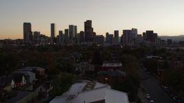 5.7K aerial stock footage of the city's skyline at sunset during descent, Downtown Denver, Colorado Aerial Stock Footage | DX0001_001860