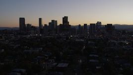 5.7K aerial stock footage of flying by the city's skyline at twilight, Downtown Denver, Colorado Aerial Stock Footage | DX0001_001863