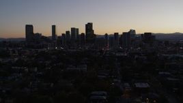 5.7K aerial stock footage of flying by the city's skyline at twilight, Downtown Denver, Colorado Aerial Stock Footage | DX0001_001864