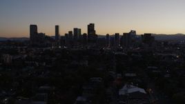 5.7K aerial stock footage of a reverse view of the city's skyline at twilight, Downtown Denver, Colorado Aerial Stock Footage | DX0001_001865