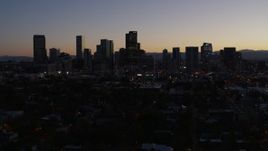 5.7K aerial stock footage flying by the city's skyline at twilight and descend, Downtown Denver, Colorado Aerial Stock Footage | DX0001_001868