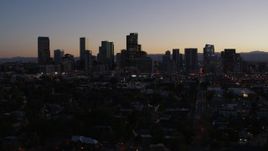 5.7K aerial stock footage ascend by the city's skyline at twilight, Downtown Denver, Colorado Aerial Stock Footage | DX0001_001869