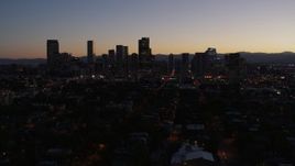 5.7K aerial stock footage of a slow descent while viewing the city's skyline at twilight, Downtown Denver, Colorado Aerial Stock Footage | DX0001_001877
