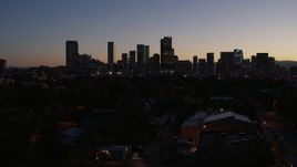 5.7K aerial stock footage of a slow approach to the city's skyline at twilight and ascend, Downtown Denver, Colorado Aerial Stock Footage | DX0001_001878