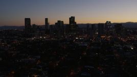 5.7K aerial stock footage fly away from and by the city's skyline at twilight, Downtown Denver, Colorado Aerial Stock Footage | DX0001_001880