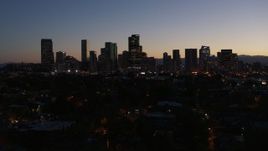 5.7K aerial stock footage of passing by the city's skyline at twilight, Downtown Denver, Colorado Aerial Stock Footage | DX0001_001883