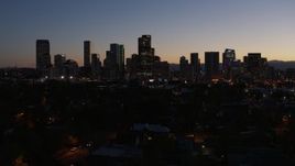 5.7K aerial stock footage of flying by the city's skyline at twilight, Downtown Denver, Colorado Aerial Stock Footage | DX0001_001884