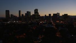 5.7K aerial stock footage fly away from the city's skyline at twilight and descend, Downtown Denver, Colorado Aerial Stock Footage | DX0001_001887