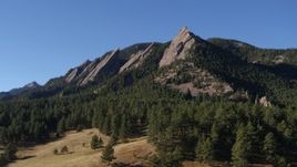 5.7K aerial stock footage of passing by and fly away from the flatirons on the side of Green Mountain in the Rocky Mountains, Colorado Aerial Stock Footage | DX0001_001899