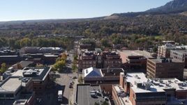 5.7K aerial stock footage flying by brick office building at quiet intersection in Boulder, Colorado Aerial Stock Footage | DX0001_001905